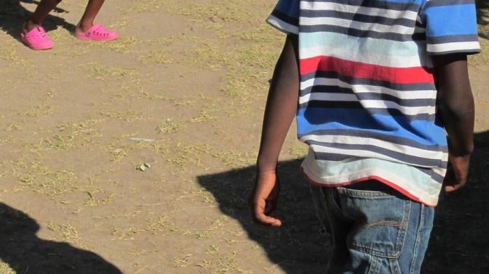 Children play in a backyard