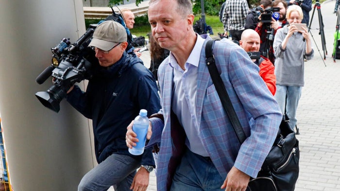 Russian lawyer Ivan Pavlov, center, walks to attend a court session after speaking to the media at Moscow Court, in Moscow, Russia, Wednesday, June 9, 2021. 