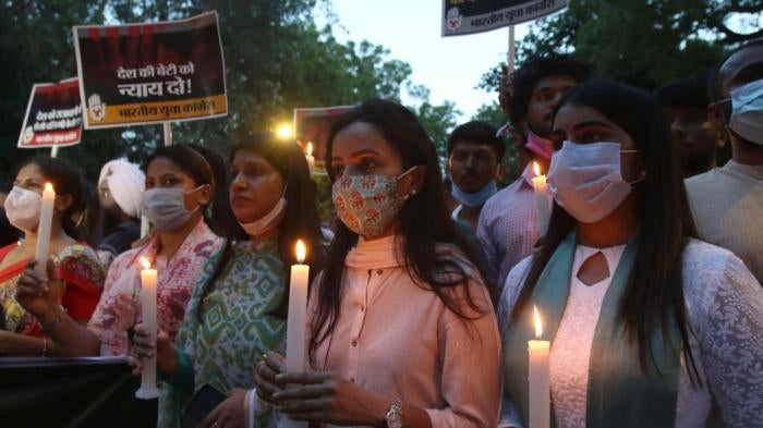 Activists hold a candlelight march protesting the alleged rape and murder of a 9-year-old Dalit girl in New Delhi, India on August 4, 2021. 