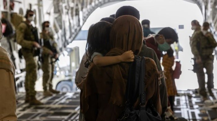 Afghanistan evacuees arrive at Australia’s main operating base in the Middle East