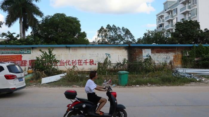 A promotion for China's defunct one-child policy remains on the outer wall of a government office in Bobai, Guangxi Zhuang autonomous region, August 26, 2021.
