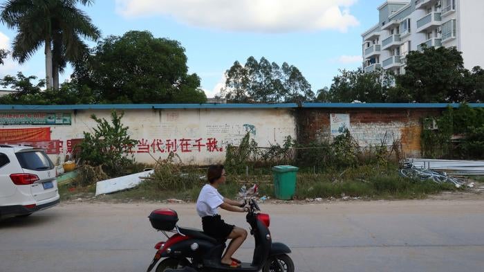 A promotion for China's defunct one-child policy remains on the outer wall of a government office in Bobai, Guangxi Zhuang autonomous region, August 26, 2021.