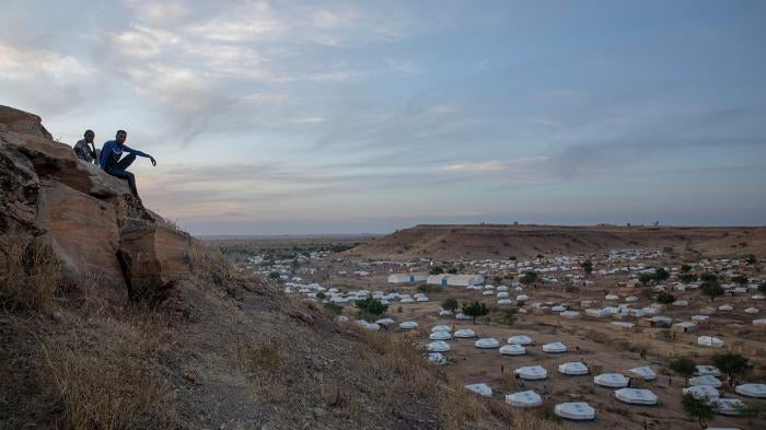 Tigrayan men sit atop a hill overlooking part of the Umm Rakouba refugee camp, in Qadarif, eastern Sudan, on December 14, 2020. 