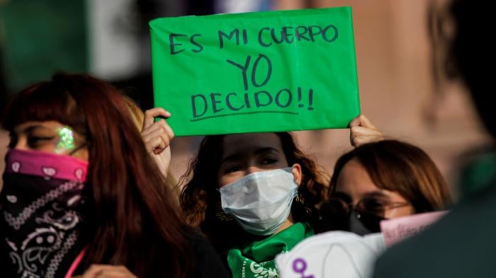 A woman holds up a banner that reads "My body, I decide" during a rally to celebrate the decision of the Mexican Supreme Court that found the total criminalization of abortion to be unconstitutional, in Saltillo, Mexico September 7, 2021.
