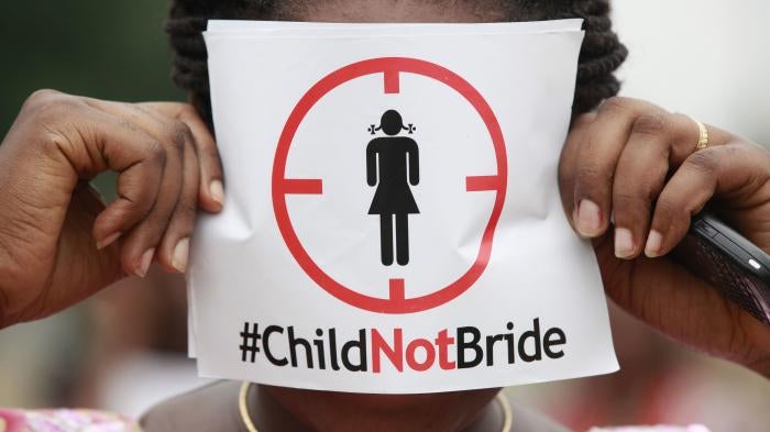 A woman protests against child marriage in Lagos, Nigeria.