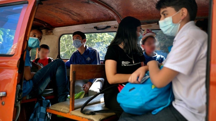 Students sit inside a school bus at the end of their school day in Beirut, Lebanon, 