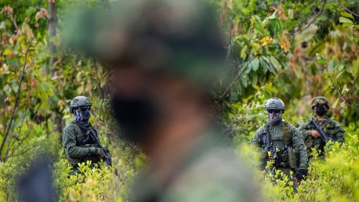 Colombian police officers during an operation in December 2020 to eradicate illicit crops in Tumaco, Nariño state, Colombia. Over three years earlier, in October 2017, seven civilians protesting eradication operations were killed in the same state.
