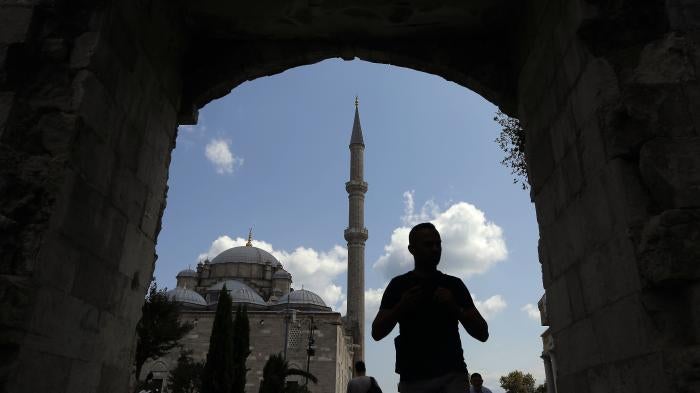 A man walks near Fatih mosque in Istanbul, Turkey.
