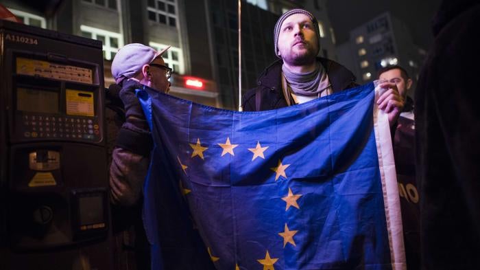 An activist holding the EU flag during a protest in Warsaw against “LGBT ideology free zones”. ©2021 Attila Husejnow / SOPA Images/Sipa USA