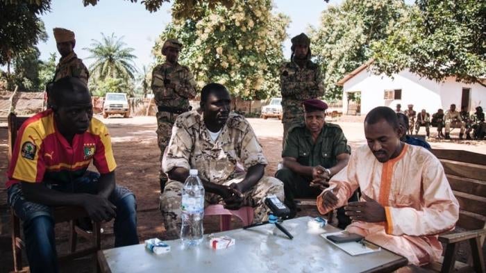 Hassan Bouba Ali (R) with Ali Darassa (C) surrounded by other UPC leaders, during a meeting at their headquarters in Alindao, October 2017. 