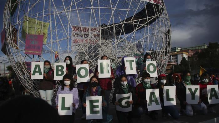 Women hold letters forming the phrase "Legal Abortion Now" during an abortion rights protest in Quito, Ecuador, Monday, September 28, 2020. 
