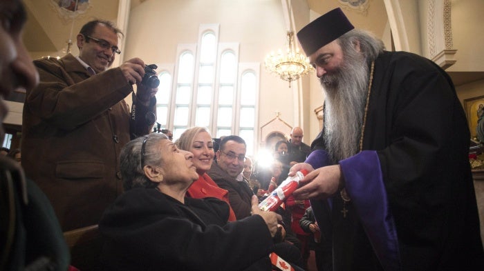 202202americas_canada_priest