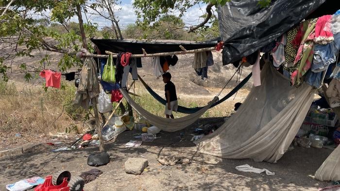 An improvised shelter in Vichada state, Colombia, where Indigenous people fleeing Venezuela's Apure state live in poor conditions, without sufficient access to food, drinking water, and health services, February 2022.