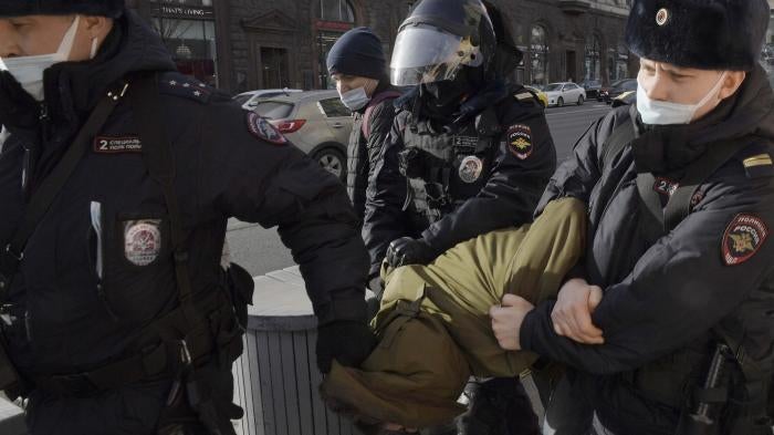 Police officers detain a protester in Manezhnaya Square, Moscow, Russia on March 6, 2022.