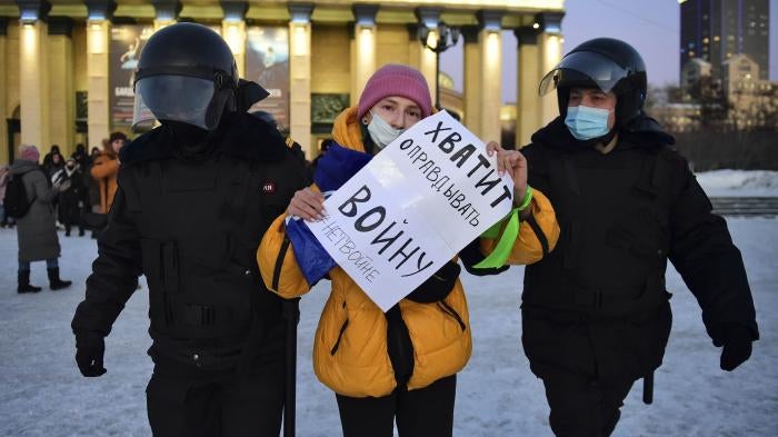 Police detain a demonstrator at a protest against the war in Ukraine, in Lenin Square, Novosibirsk on March 2, 2022.