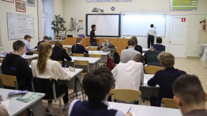 Students at desks in a classroom