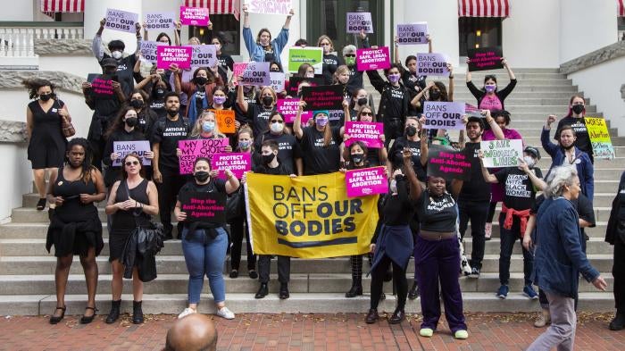 Advocates stand at the Florida Capitol in Tallahassee to protest a bill before the Florida legislature to limit abortions, February 16, 2022.