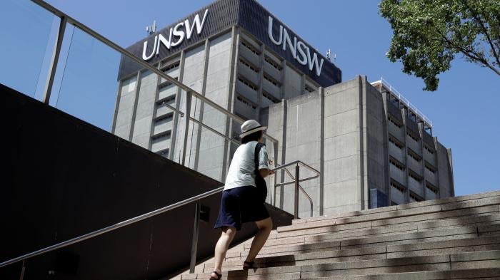 A student walks around the University of New South Wales campus in Sydney, Australia, December 1, 2020.