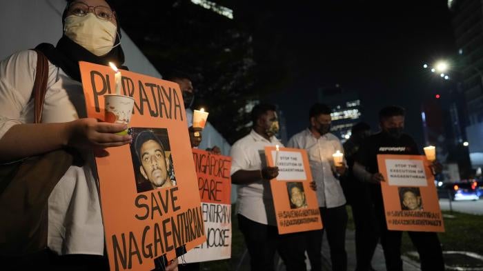 Activists holds posters against the impending execution of Nagaenthran K. Dharmalingam