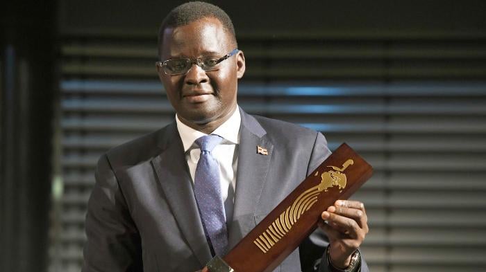 Nicholas Opiyo, human rights lawyer and founder of Chapter Four Uganda, holds the German Africa Award