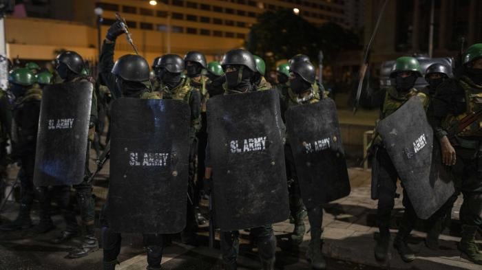 Sri Lankan army soldiers prepare to remove protesters and their tents from the site of a protest camp in Colombo, Sri Lanka, July 22, 2022.