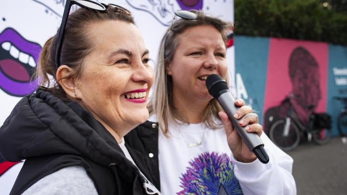 Justyna Wydrzyńska (left) and a colleague from the group Abortion Dream Team address a gathering in Warsaw city center to share the experiences of people who needed abortions, September 28, 2021.