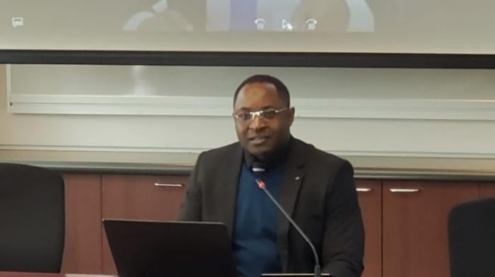 Abdul Karim Ali speaking at a conference