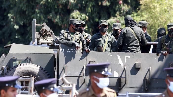 Sri Lankan police and military personnel near the parliament in Colombo, July 19, 2022.