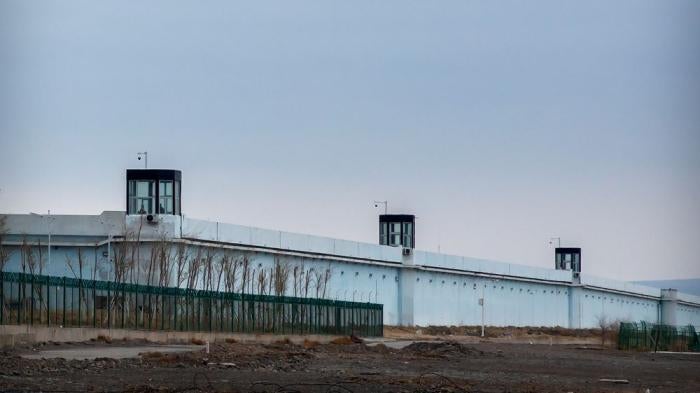 Guard towers on the perimeter wall of the Urumqi No. 3 Detention Center