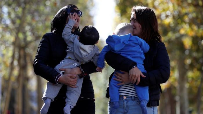 Amandine Giraud and her wife Laurene Corral with their children conceived with fertility assistance in Paris, France