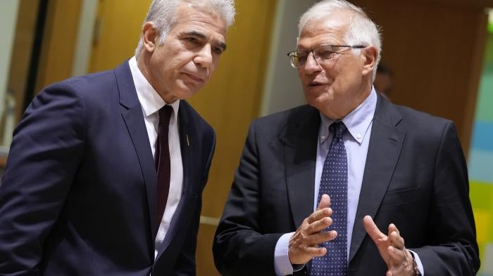 Yair Lapid, then Israeli foreign minister and current prime minister, speaks with the EU’s High Representative for Foreign Affairs and Security Policy Josep Borell during a July 2021 meeting of EU foreign ministers in Brussels.