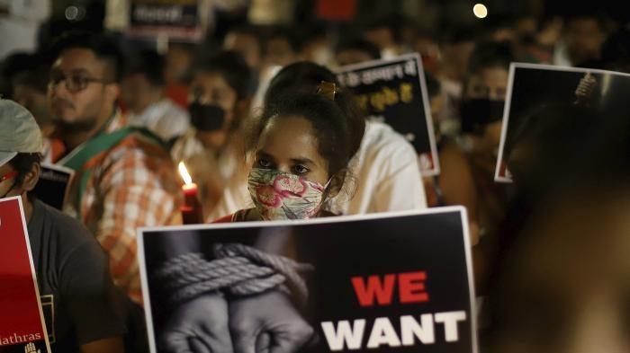 Activists protest against gender-based violence, in Delhi, India.