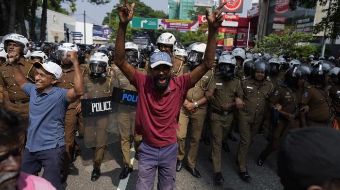 A protestor shouts against the detention of two student leaders in Sri Lanka.