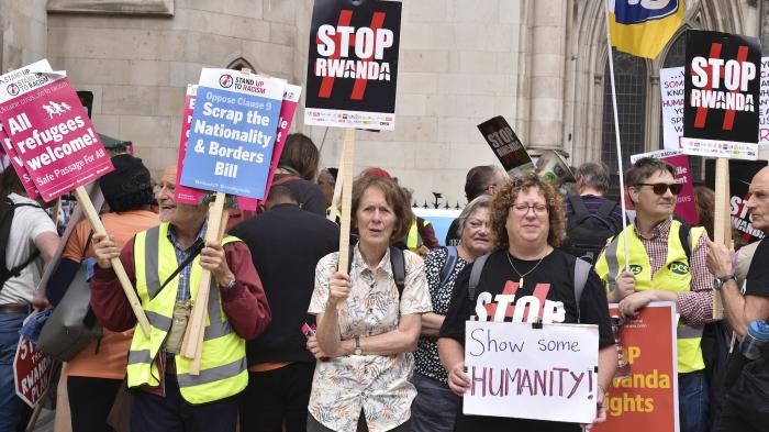 Protesters gathered opposite The Royal Courts Of Justice over UK's agreement with Rwanda. 