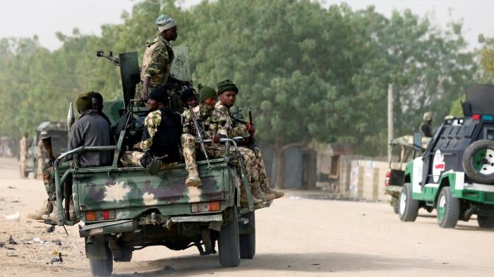 Nigerian military ride on their truck in Maiduguri. 