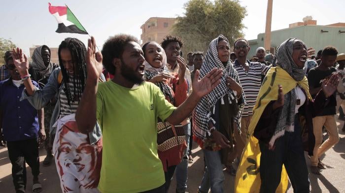 Sudanese demonstrators march in Khartoum, Sudan, Thursday, Dec. 8, 2022 to protest a deal signed between the country’s main pro-democracy group and its ruling generals. 