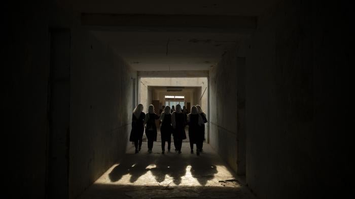 Female high school students in a hallway