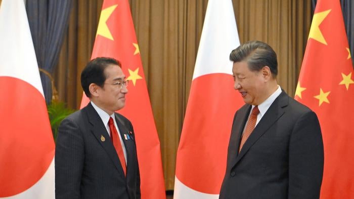 China's President Xi Jinping (R) and Japan's Prime Minister Fumio Kishida meeting in Bangkok, Thailand.