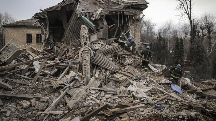 Ukrainian firefighters work at a damaged hospital maternity ward in Vilniansk, Zaporizhzhia region, Ukraine.