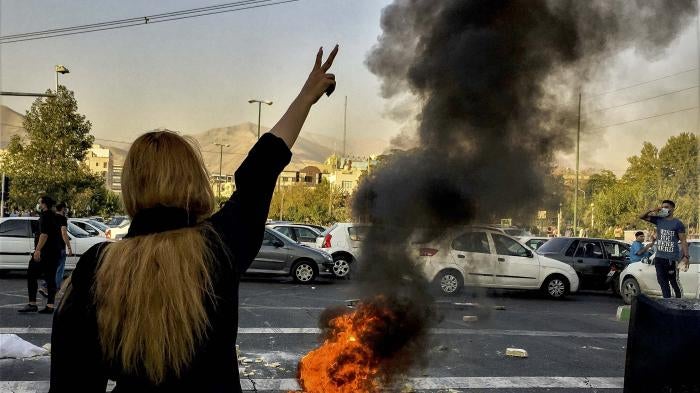 Iranians protests the death of 22-year-old Mahsa Amini after she was detained by the morality police, in Tehran, October 1, 2022.
