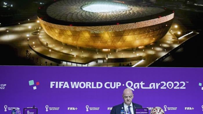 FIFA President Gianni Infantino sits in front of a screen showing the Lusail Final Stadium before he meets the media at the FIFA World Cup closing press conference in Doha.