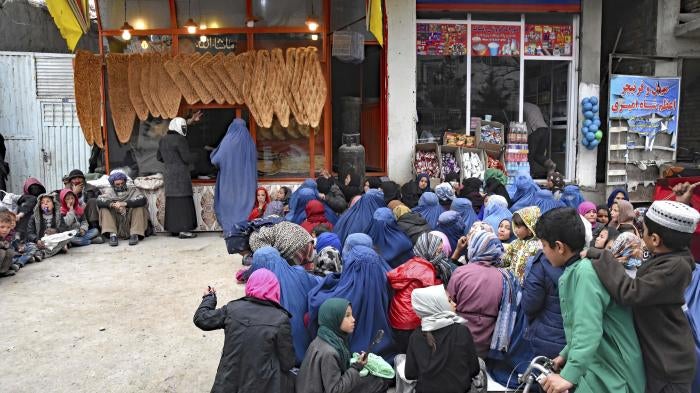 Women and children in need of food outside a bakery in Kabul, Afghanistan, February 28, 2022.