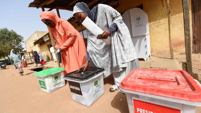 Women cast their ballots as they vote in the presidential and parliamentary elections on February 23, 2019, at a polling station in Daura, Katsina State, northwest Nigeria. 