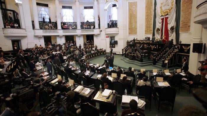 Legislators attend a session of Mexico City’s Congress 