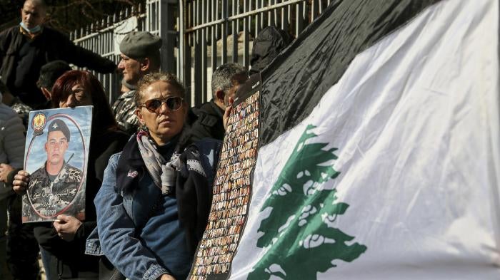Lebanese activists and families of the victims of the 2020 Beirut port blast gather outside the Palace of Justice to protest a decision by Lebanon's top prosecutor to release the suspects detained in connection with the explosion. 