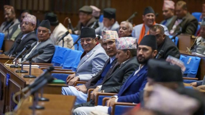 Nepali Prime Minister Pushpa Kamal Dahal, center, sits among other party leaders in parliament in Kathmandu, Nepal.