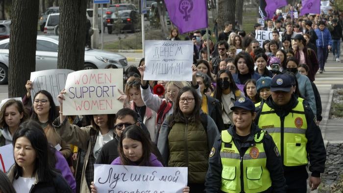 Women march in a protest for International Women's Day