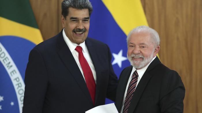 Venezuela's President Nicolas Maduro, left, and Brazilian President Luiz Inacio Lula da Silva smile at a press conference after their bilateral meeting at Planalto palace in Brasilia, Brazil, May 29, 2023. 