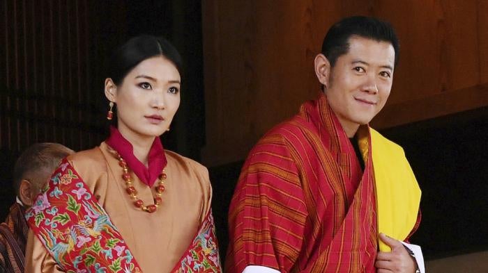 The king of Bhutan, Jigme Khesar Namgyel Wangchuck, and his wife attend the enthronement ceremony at the Imperial Palace in Tokyo.