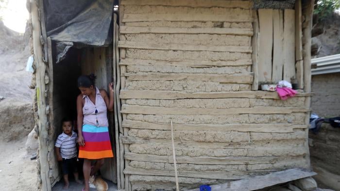 A woman and her son at their home in the community of El Redondo, municipality of Trojes, Honduras, April 28, 2021.